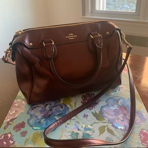 Small burgundy Coach crossbody purse